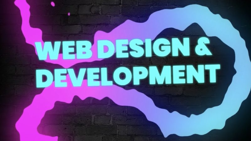 Brick wall background with neon elements on top. The text reads, "web design & development"