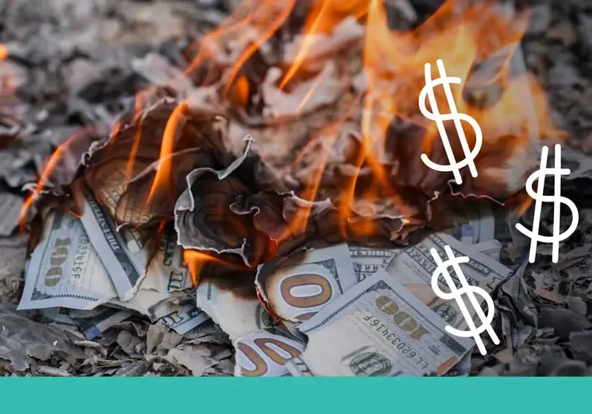 A pile of one-hundred-dollar bills burning in a fire with three white hand-drawn dollar signs floating above the flames. The image has a teal banner at the bottom.
